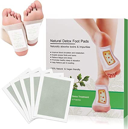 Zyvoura Kinoki Cleansing Detox Foot Pads shown on feet, promoting relaxation and detoxification in health and beauty routine.