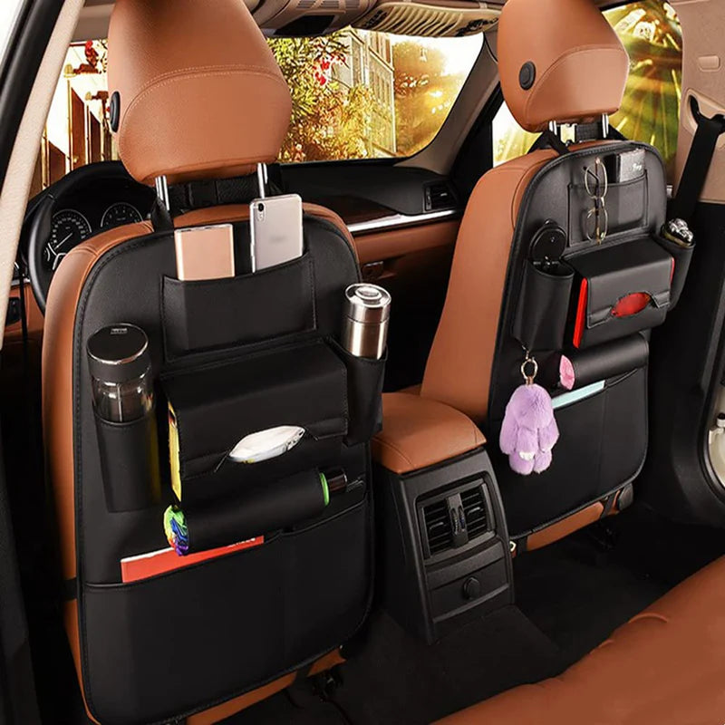 Zyvoura Car Seatback Organizer hanging on car seat with multiple pockets for storage and organization of travel essentials.