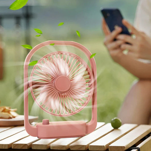 Zyvoura portable mini desktop fan with adjustable blades and compact design, ideal for personal cooling on a desk.