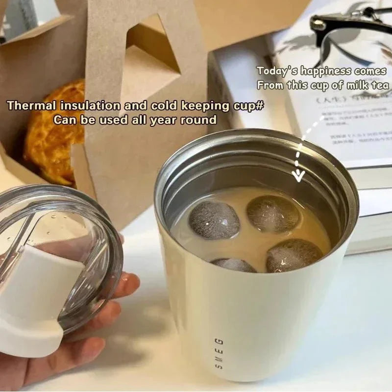 Zyvoura Smeg stainless steel vacuum insulated tumbler mug with a sleek, modern design and spill-proof lid.